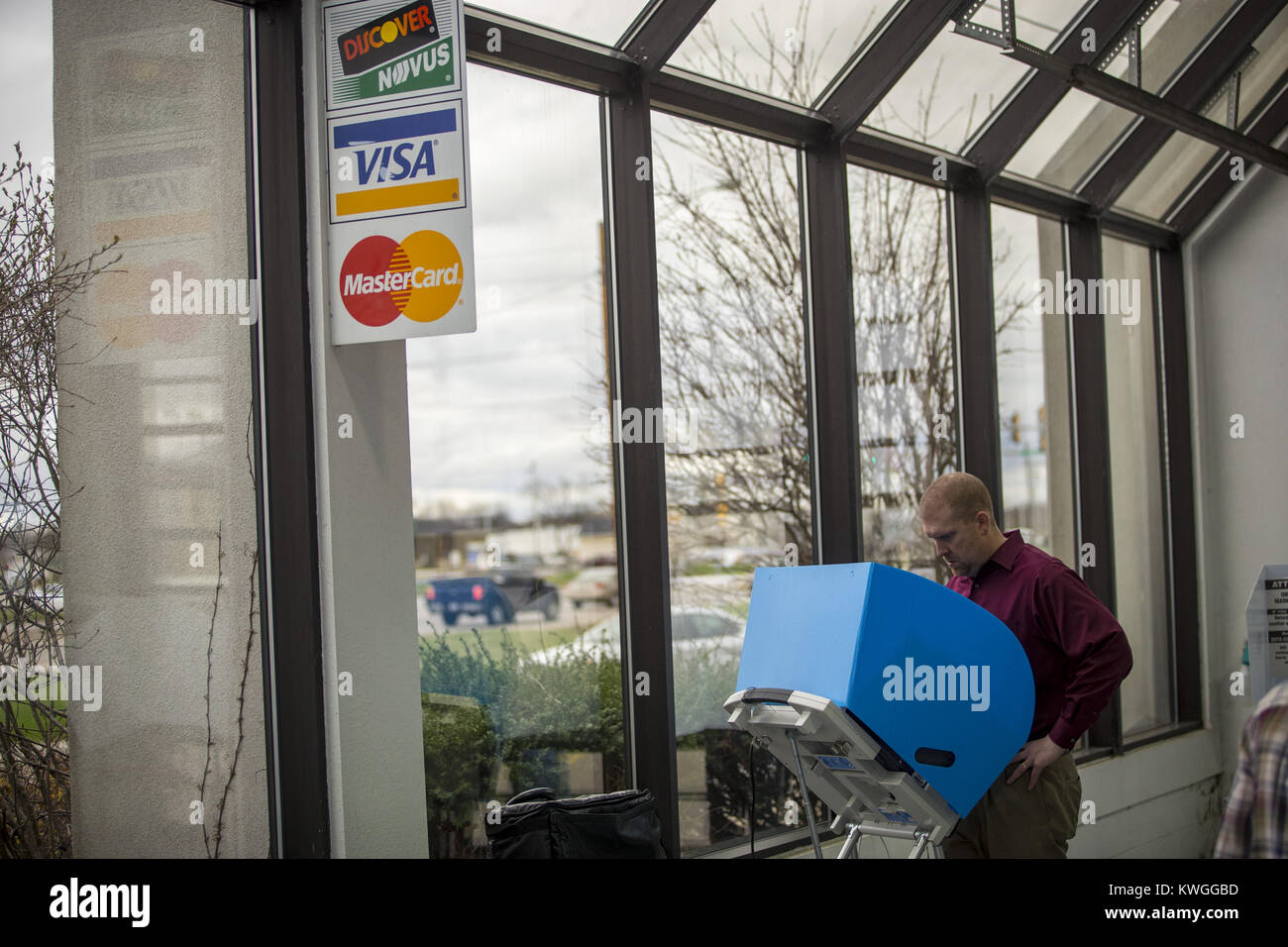 East Moline, Iowa, USA. 4th Apr, 2017. Brian Brahm of Moline casts his ballot electronically at