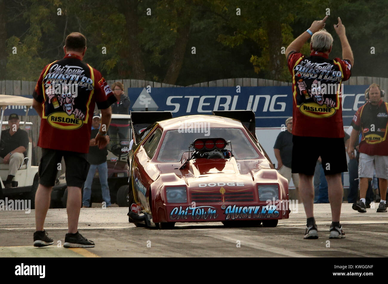 Cordova, Iowa, USA. 26th Aug, 2017. Pit crew members line up the Chi Town Hustler dirven by Mike Minnik in the Nostalgia Funny Car class, Saturday, August 26, 2017, during the Cordova 64th annual World Series of Drag Racing at Cordova International Raceway Park in Cordova. Credit: John Schultz/Quad-City Times/ZUMA Wire/Alamy Live News Stock Photo