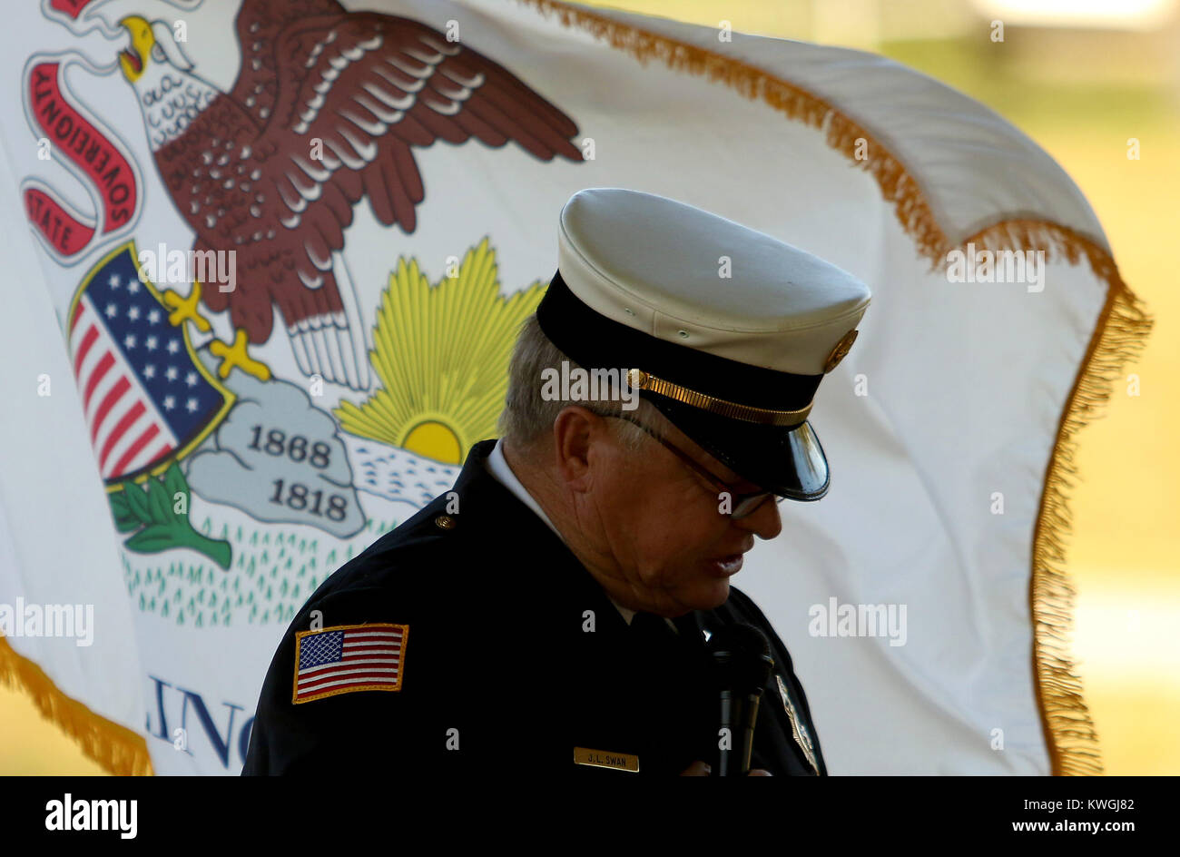 Colona, Iowa, USA. 10th Sep, 2017. Colona Fire Chief John Swan Sr. speaks from the podium before a small crowd, Sunday, September 10, 2017, during a 911 remembrance ceremony held at the Colona Canal Pavilion in Colona. Credit: John Schultz/Quad-City Times/ZUMA Wire/Alamy Live News Stock Photo