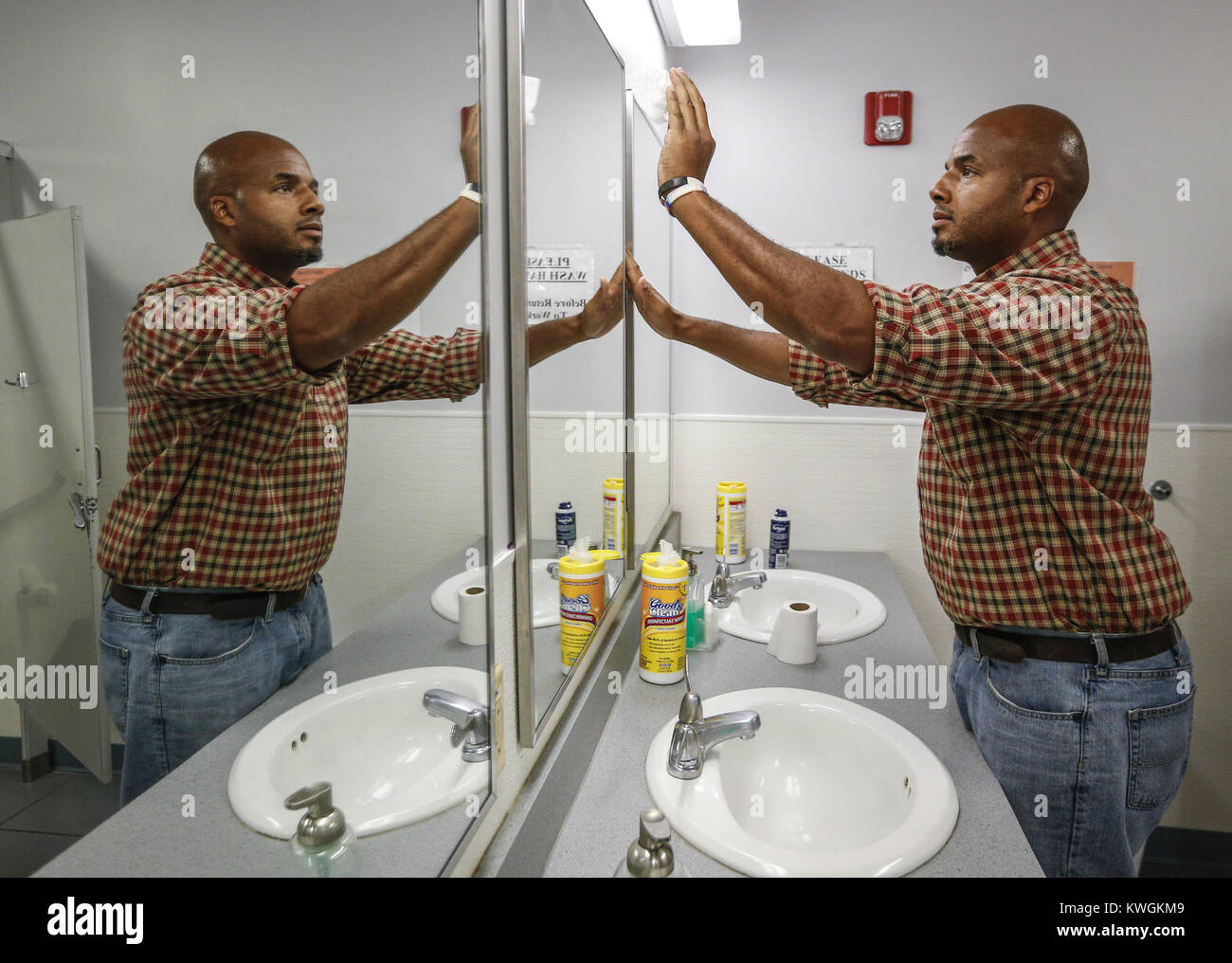 Davenport, Iowa, USA. 3rd Aug, 2016. LeShawn Townsend cleans the mirror in the men's bathroom at the Christian Care Homeless Shelter in Rock Island on Wednesday, August 3, 2016. Townsend says that the regular schedule at the shelter, including chores, helps him keep focused and feel appreciated from day to day. Credit: Andy Abeyta/Quad-City Times/ZUMA Wire/Alamy Live News Stock Photo