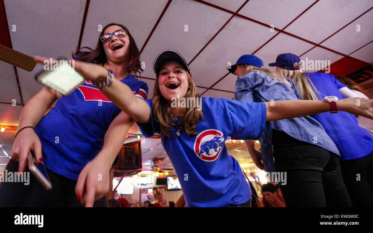 Davenport, Iowa, USA. 2nd Nov, 2016. Alyssa Hawk of Aurora, Illinois, left, and Rachel Lemek of Bloomington, Illinois, right, dance on the bar at Rookies Sports Bar and Grill after watching the Cubs win the World Series in Davenport on Wednesday, November 2, 2016. The Cubs won game seven of the World Series against the Cleveland Indians 8-7, winning the series for the first time in 108 years. Credit: Andy Abeyta/Quad-City Times/ZUMA Wire/Alamy Live News Stock Photo