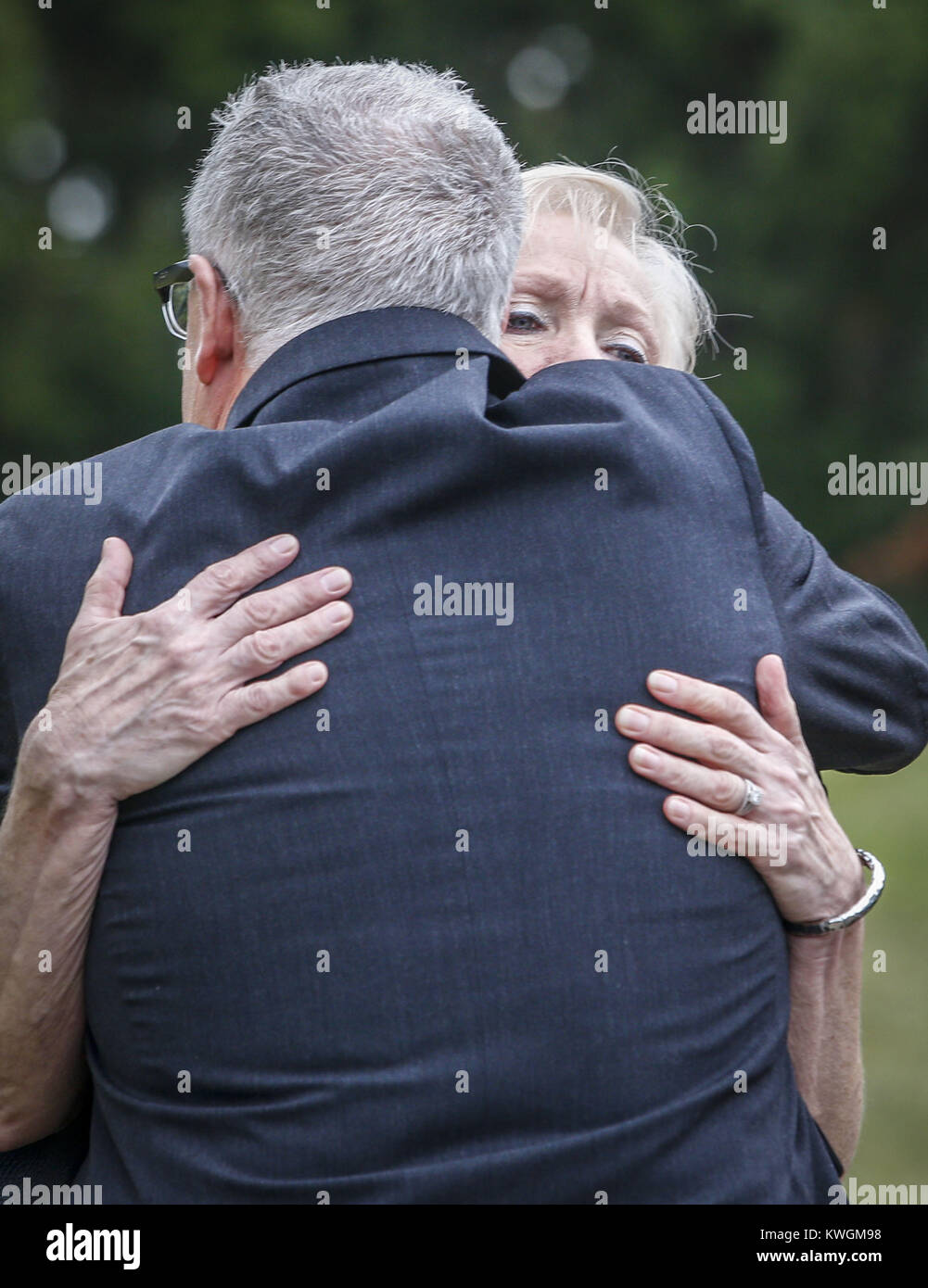 Davenport, Iowa, USA. 24th Sep, 2016. Mary Seng, wife of state Rep. Joe Seng, receives a hug from Staff Director for the Iowa Senate Democratic Caucus, Ron Parker, at Sacred Heart Cathedral in Davenport on Saturday, September 24, 2016. The funeral for state Rep. Joe Seng, 69, who died Sept. 16 of a brain tumor was held before a number of family members, friends, and colleagues. Credit: Andy Abeyta/Quad-City Times/ZUMA Wire/Alamy Live News Stock Photo