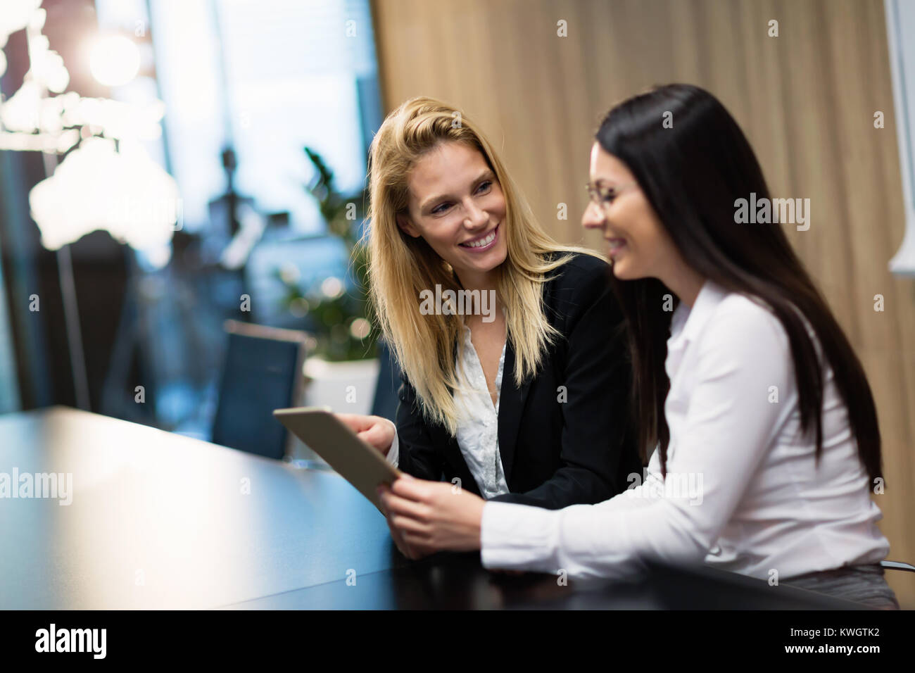 Two business people having a meeting in office Stock Photo - Alamy