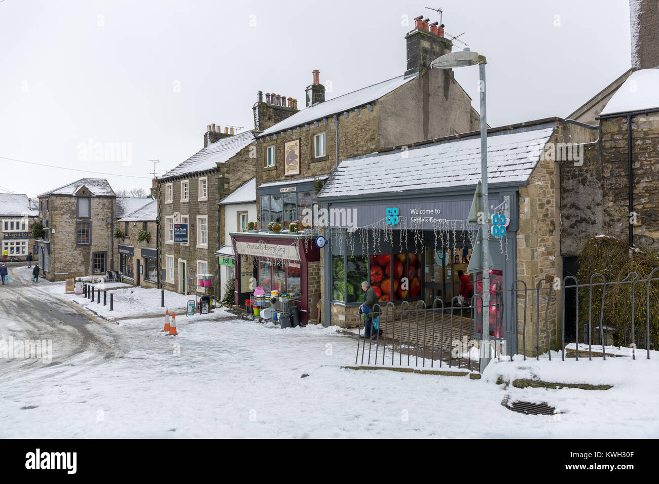 Winter snow scenes near the North Yorkshire village of Settle showing village life trapped by