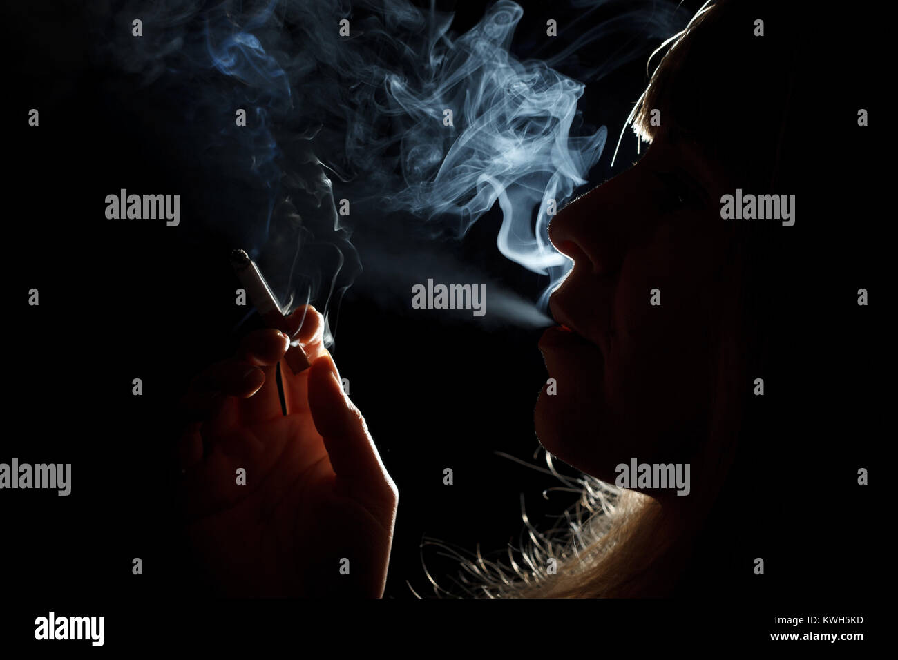 Silhouette of a cigarette smoker Stock Photo - Alamy