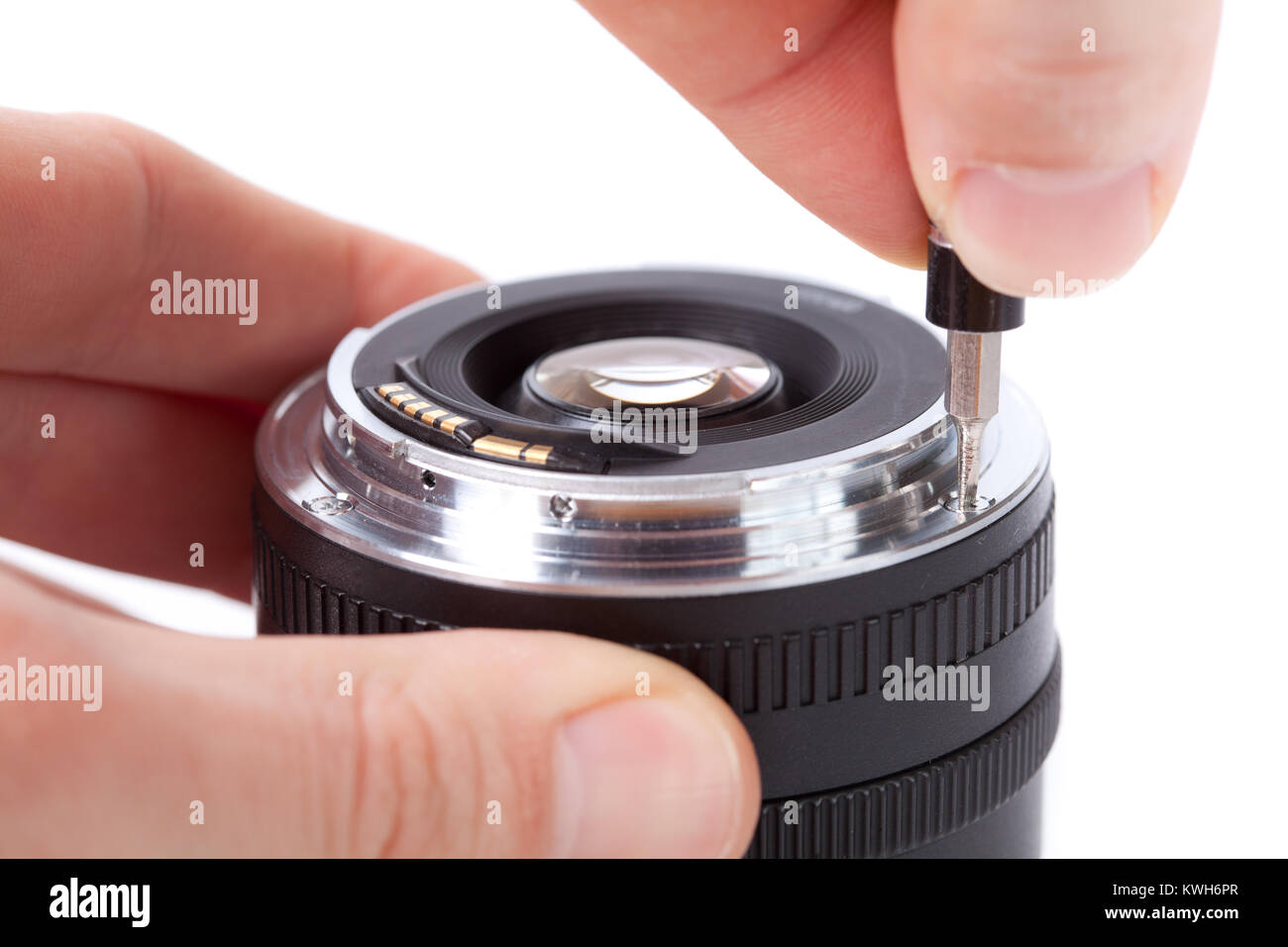 Technician repairing lens, removing lens mount Stock Photo Alamy