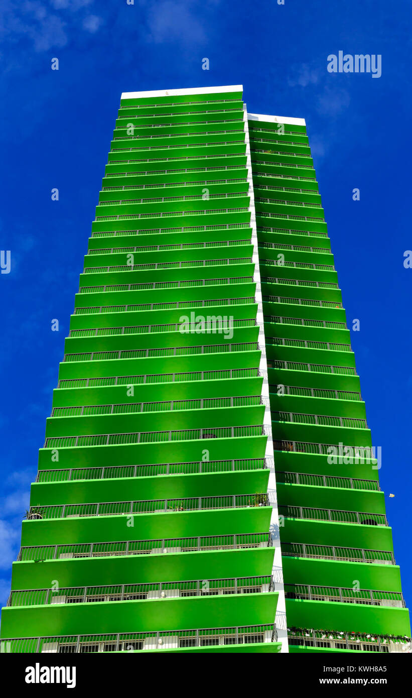 Luxury Condo with Green Balconies on Blue Sky Stock Photo