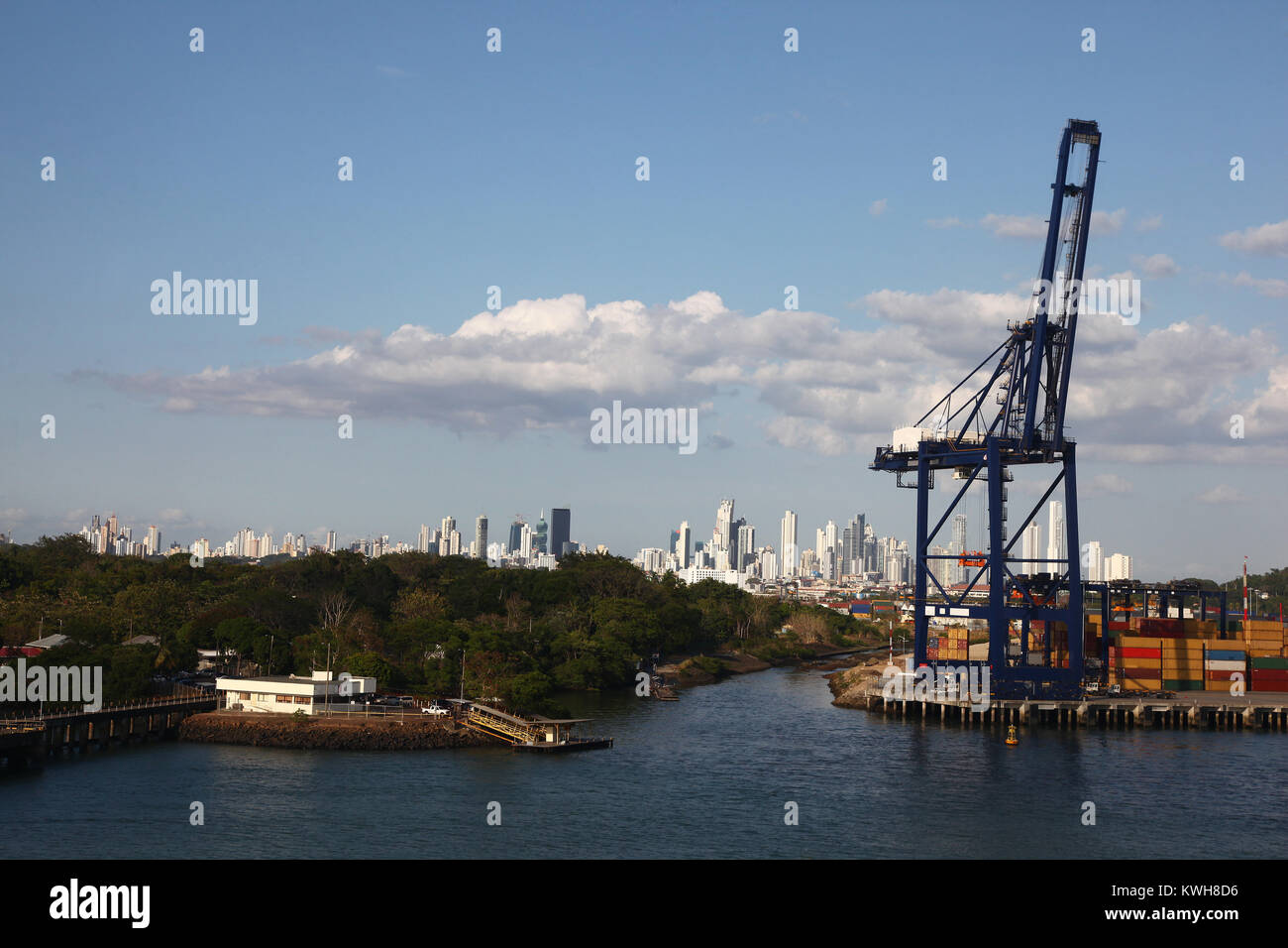 Cargo port with crane & shipping containers along the entrance to the ...