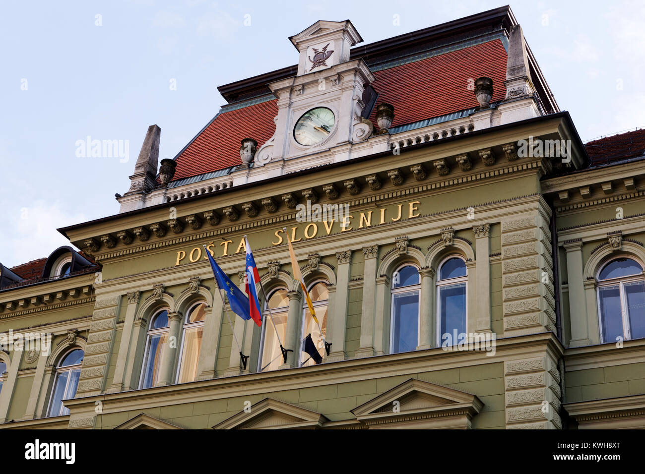 The Slovene Post Office in Maribor, Slovenia. Flags fly outside of the  building Stock Photo - Alamy