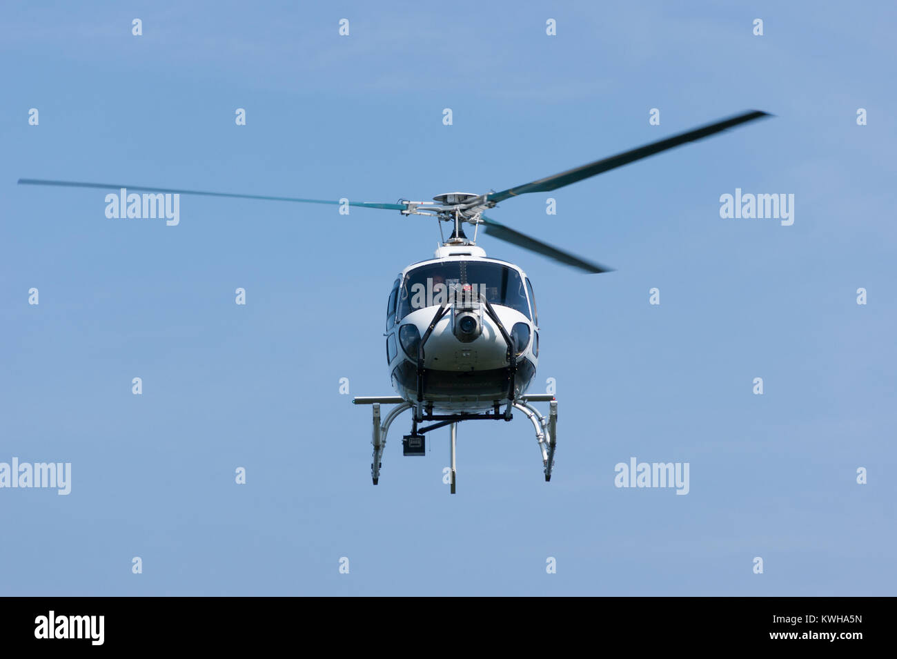 Helicopter flying, front view close-up (An Airbus Helicopters / Eurocopter AS 350 Écureuil pictured at Plan de Corones, South Tyrol, Italy) Stock Photo