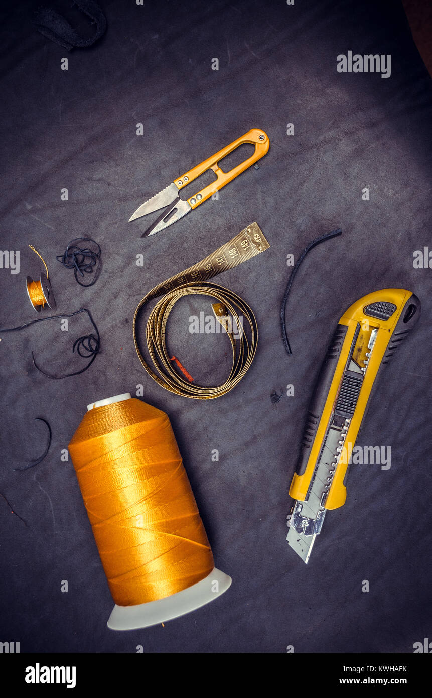 yellow coil centimeter Sewing Tools on Black Background Stock Photo