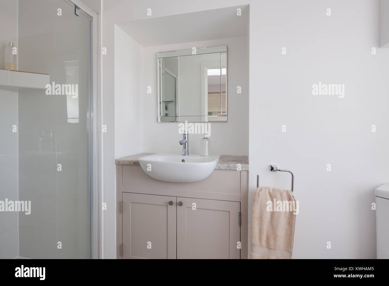 Plain white decorated white shower room closet with shower cubicle ...