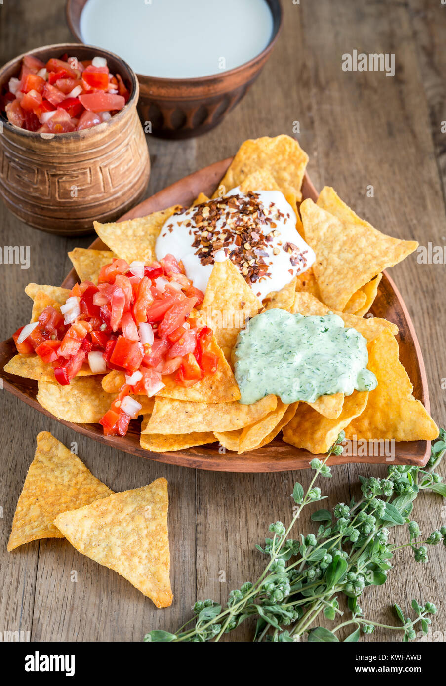 Cheese nachos with different types of sauce Stock Photo Alamy