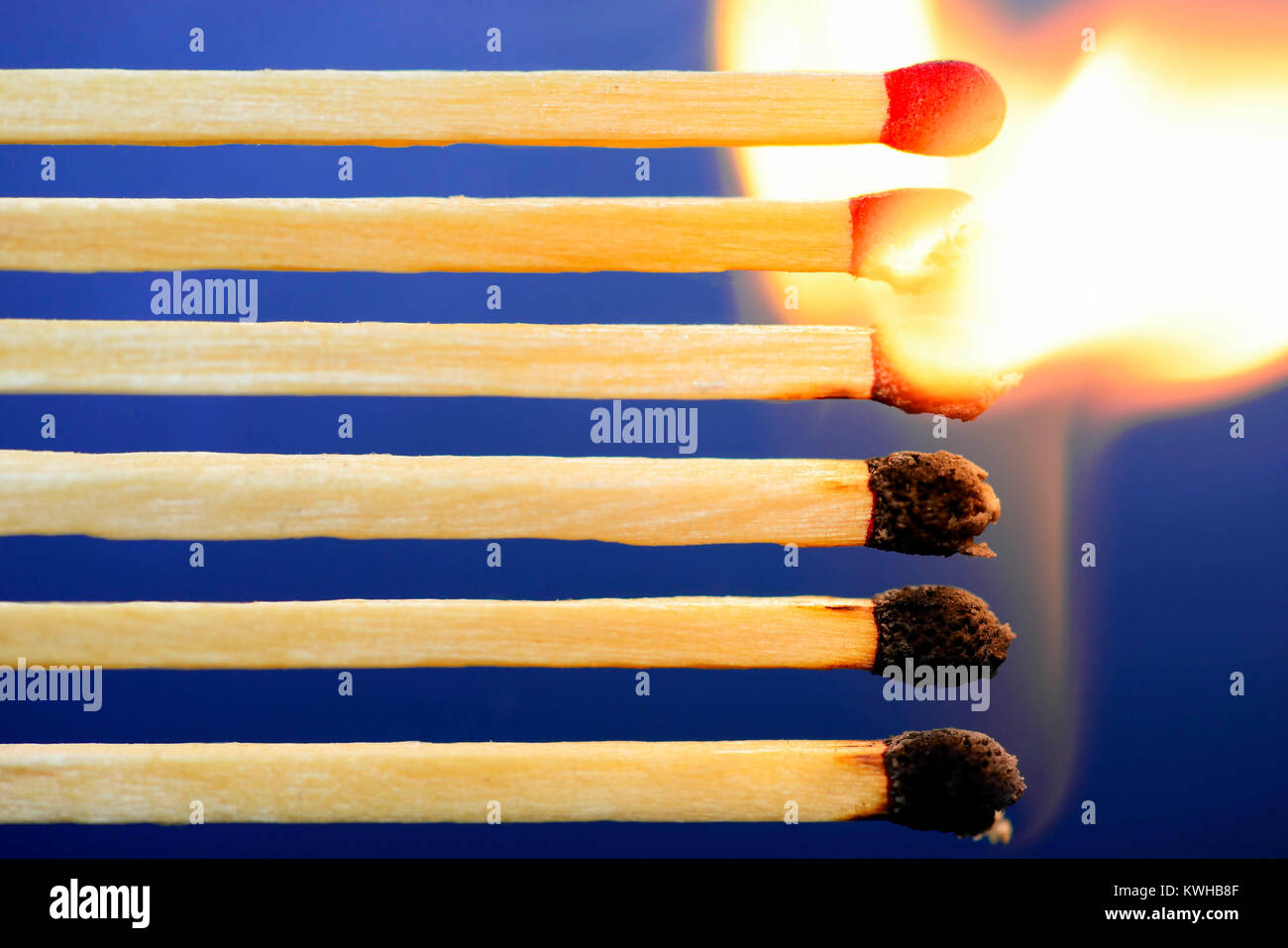 Chain reaction of burning matches, symbolic photo Grexit, Kettenreaktion brennender StreichhÃ¶lzer, Symbolfoto Grexit Stock Photo