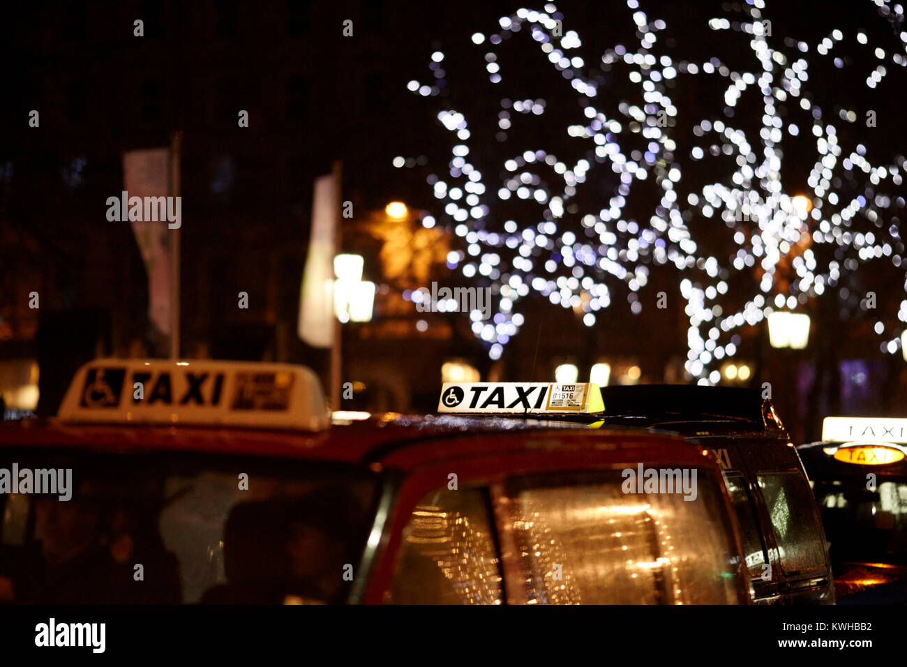 signs on top of london cabs taxis at a cab rank over the christmas period belfast northern ireland uk Stock Photo