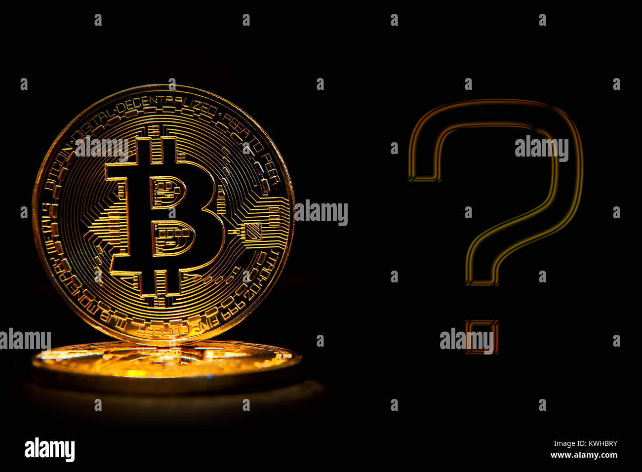 Bit coin isolated on black background with text question Stock Photo