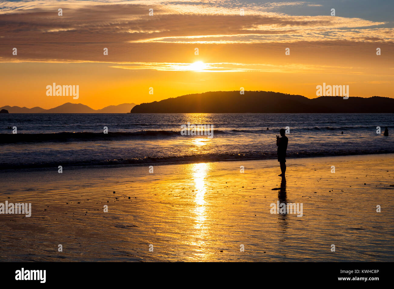 Silhouette Woman At Beach During Sunset Stock Photo - Alamy