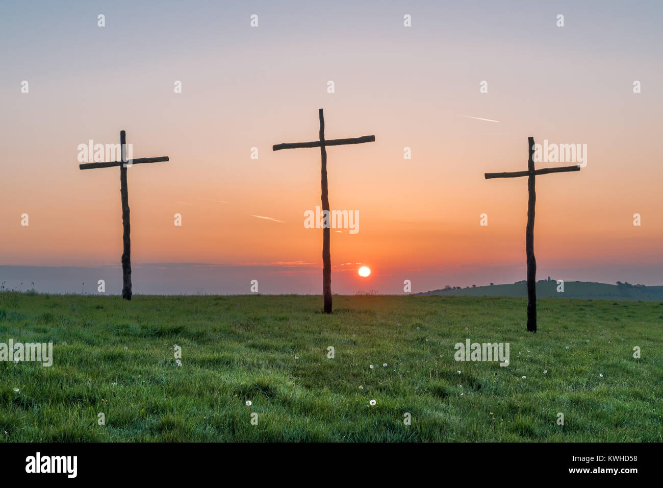 Easter sunrise, the  cross or  crucifix, placed on high downland to celebrate the christian festival Stock Photo