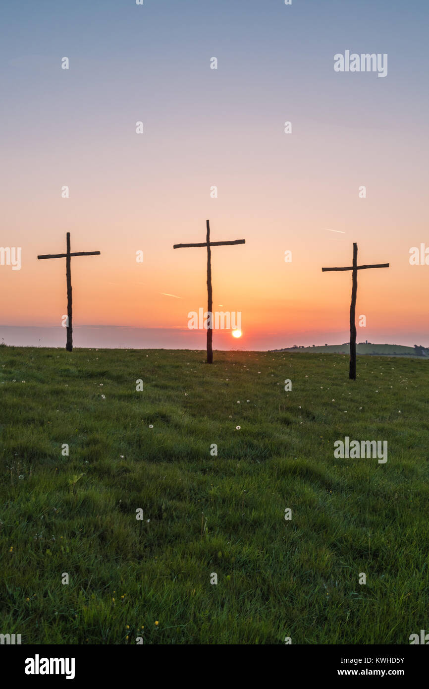 Easter sunrise, the  cross or  crucifix, placed on high downland to celebrate the christian festival Stock Photo