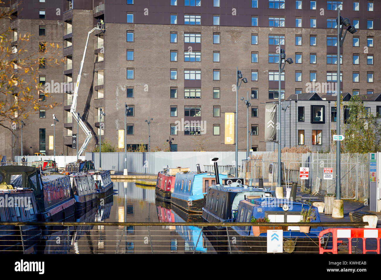 Marina at New Islington, Ancoats, East Manchester, mored narrowboats used as homes and new