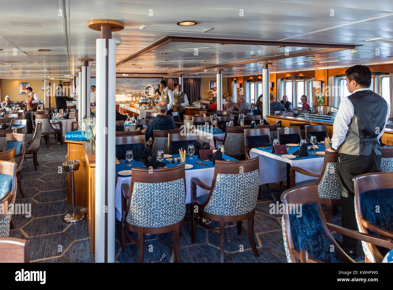 Dining room; passenger ship Ocean Adventurer carries alpine mountaineering skiers to Antarctica Stock Photo
