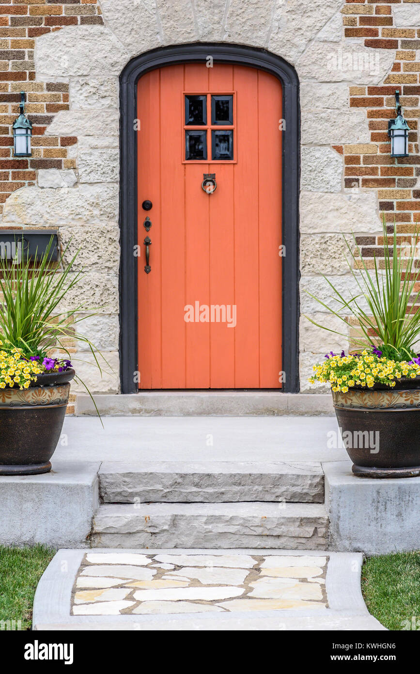 colorful front door of custom brick home Stock Photo