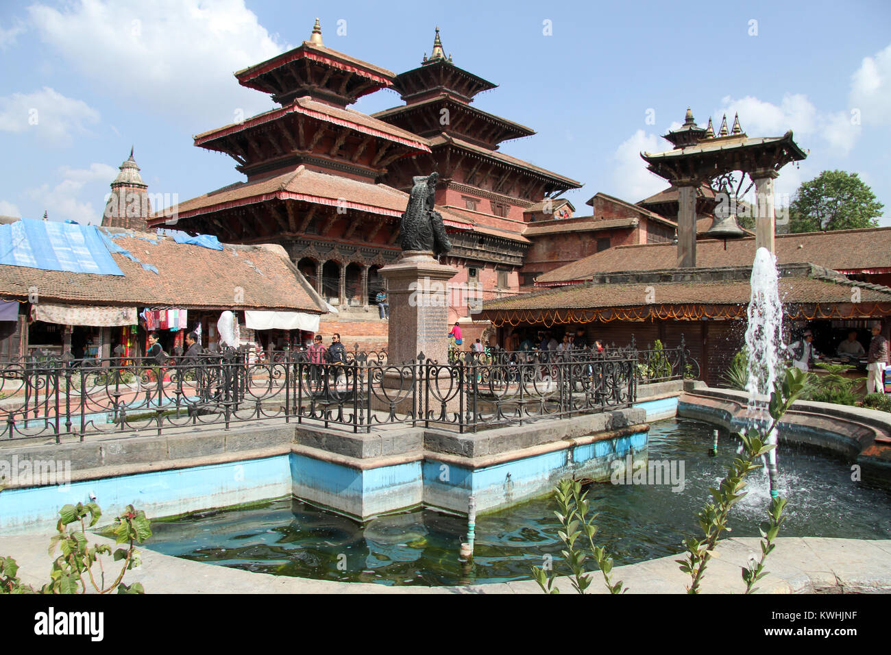 Fountain and temples on the Durbar square in Patan, Nepal Stock Photo