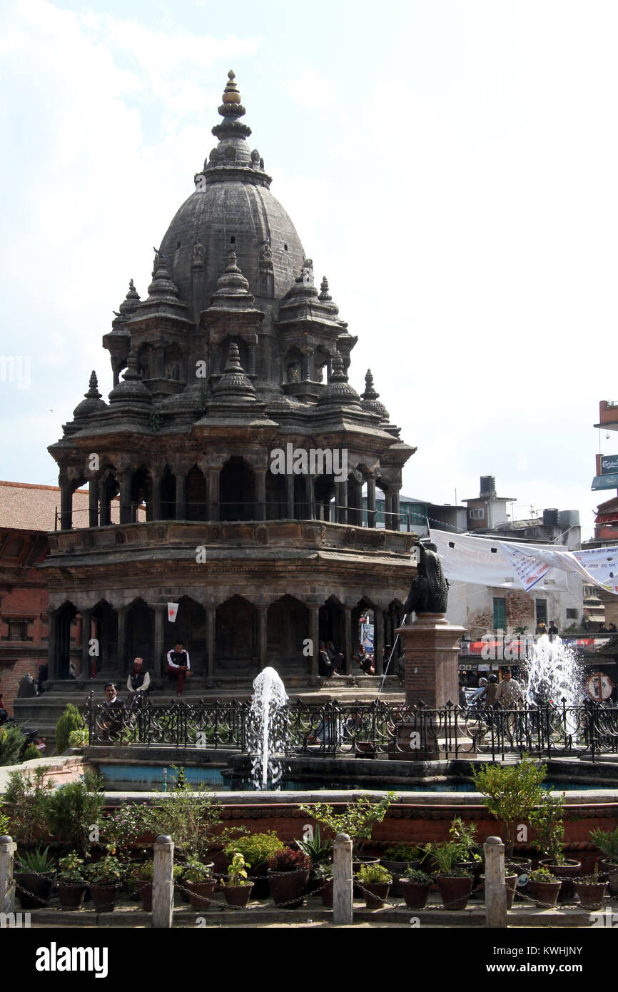 Fountain and temple on the Durbar square in Patan, Nepal Stock Photo