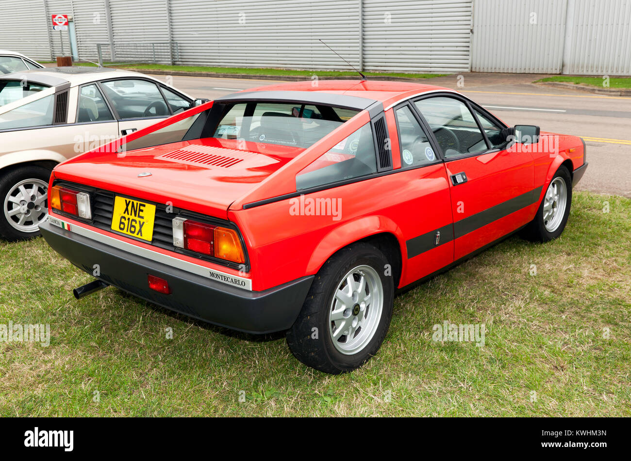Three-quarter rear view of  a  Red, 1982 Lancia Montecarlo, on static display at the 2017 Silverstone Classic Stock Photo