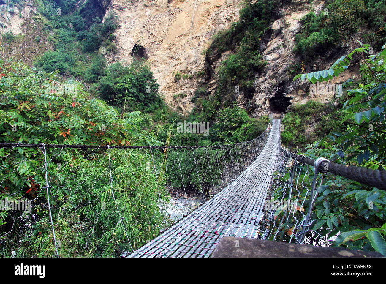 Suspension bridge and mountain in Nepal Stock Photo - Alamy