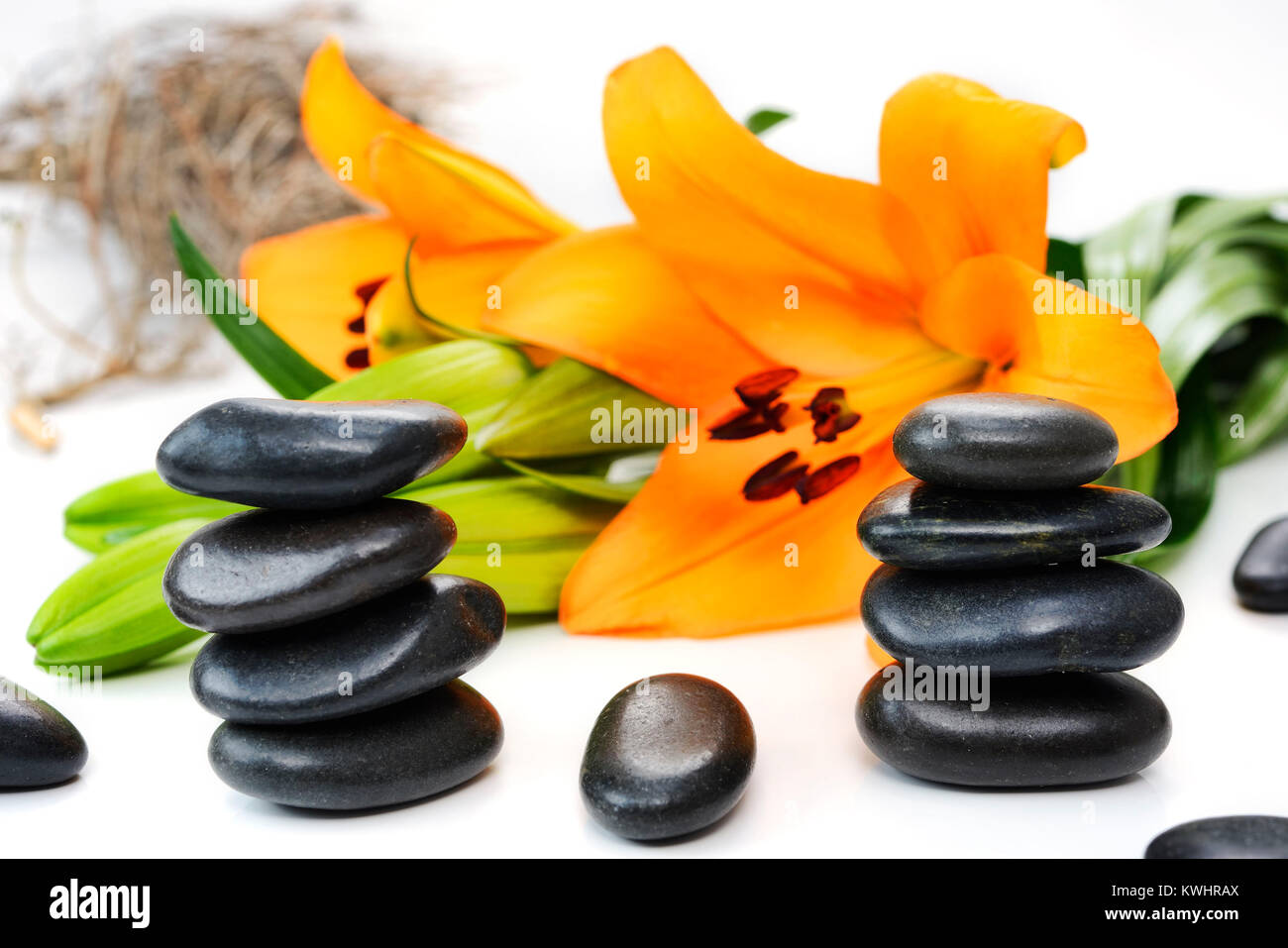 Stacked stones and lily, esotericism, Gestapelte Steine und Lilie, Esoterik Stock Photo