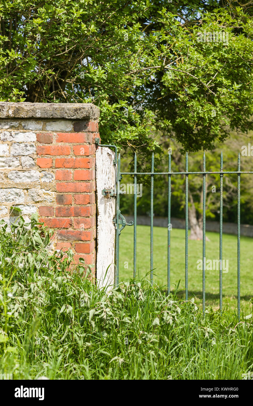 Metal gate brick wall hi-res stock photography and images - Alamy