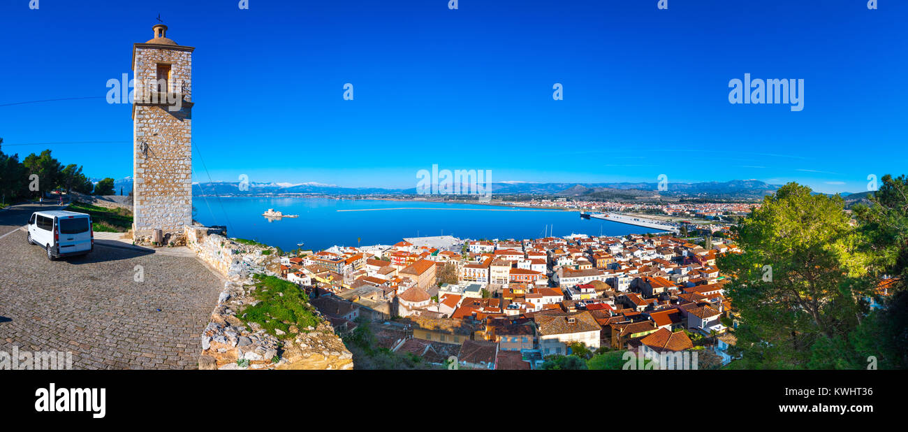 Old town of Nafplion in Greece view from above with tiled roofs, small port and bourtzi castle on the Mediterranean sea water Stock Photo