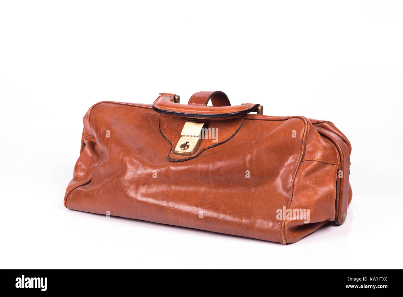 Vintage leather travel bag over a white background Stock Photo Alamy