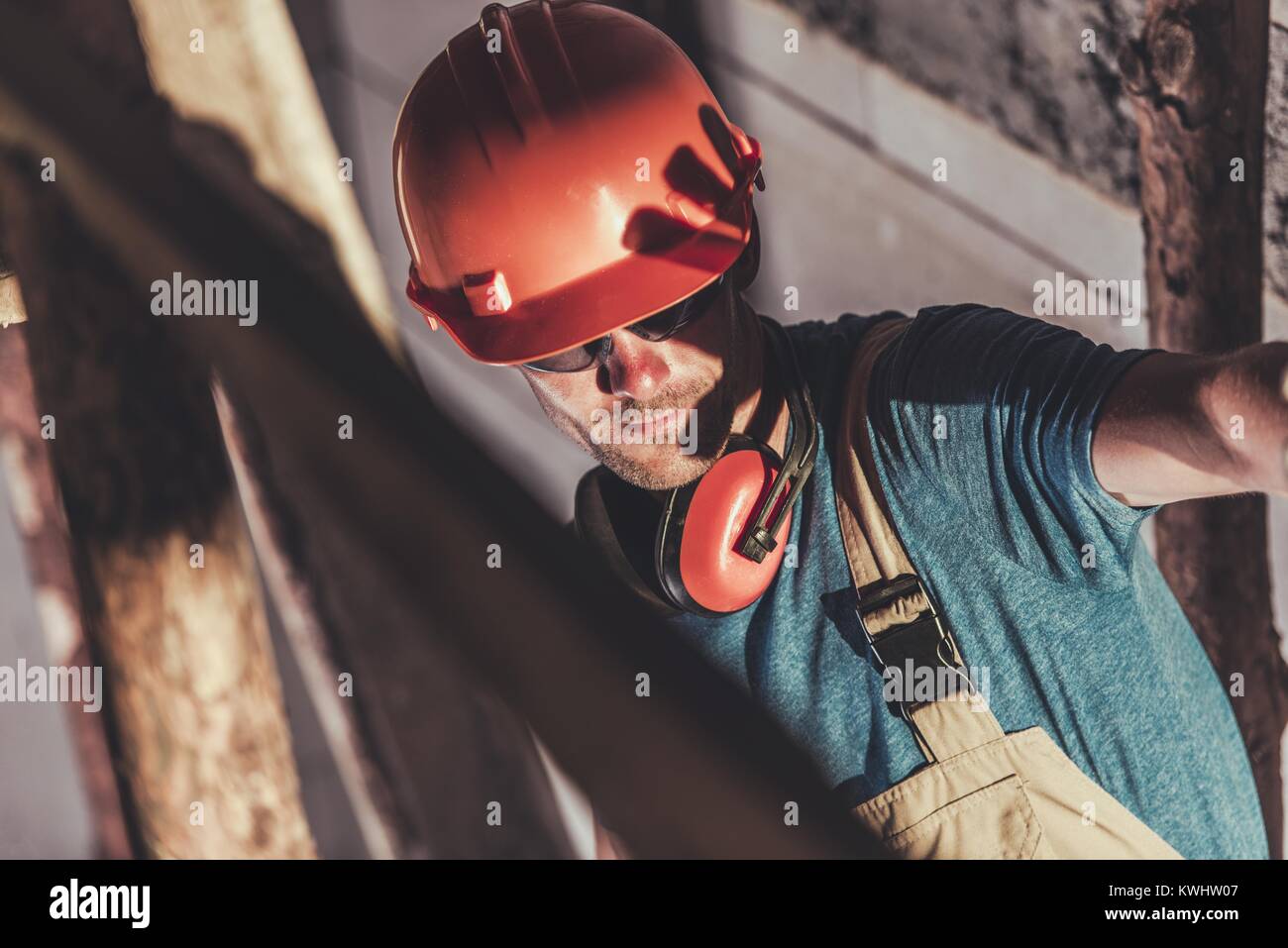 Disturbing Industrial Welding Light. Caucasian Construction Site Worker Covering His Face From Bright Dangerous For Eyes Light Coming From Electric We Stock Photo