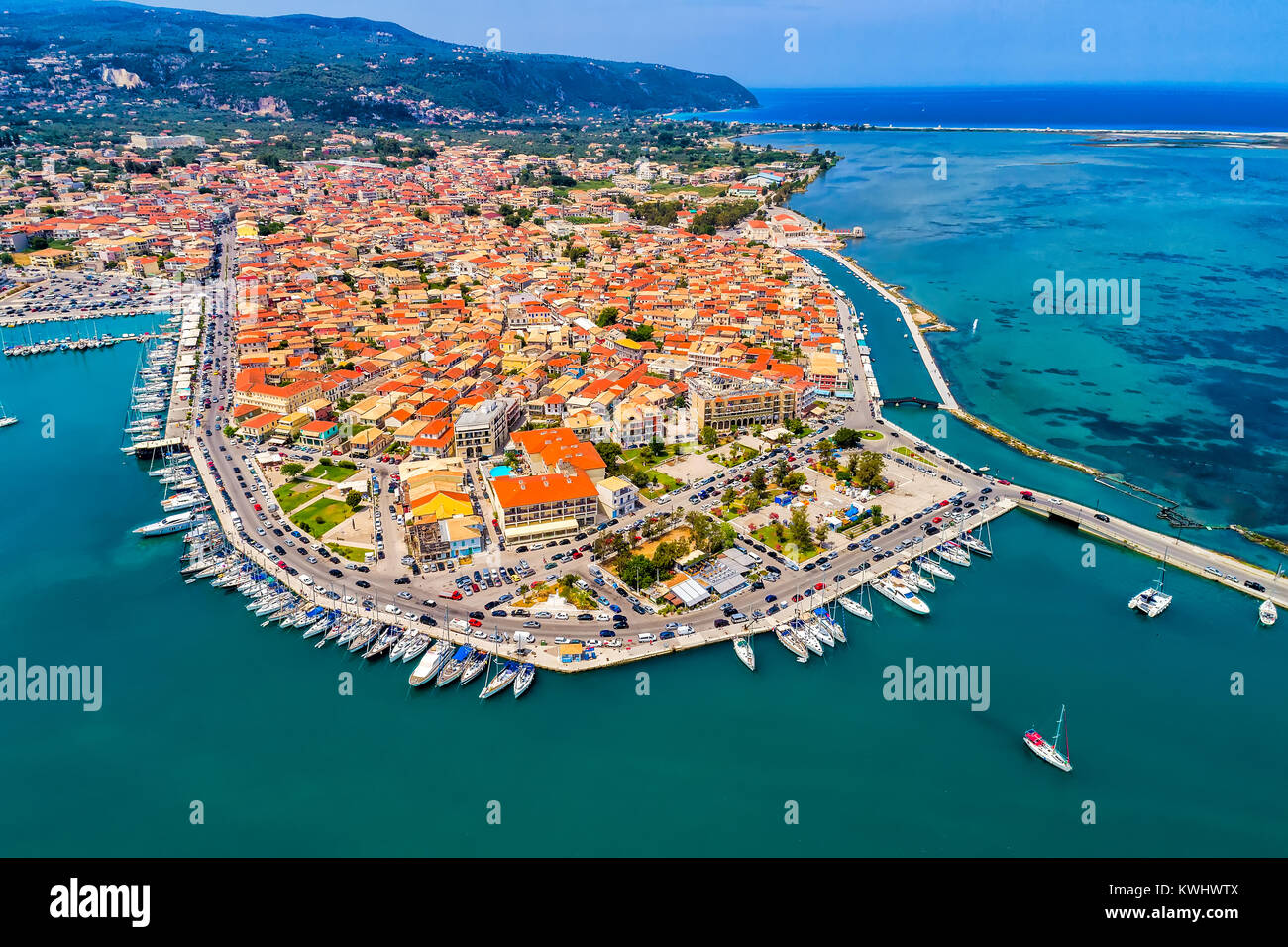 Sailboats in the marina and the city of Lefkada island, Greece Stock Photo