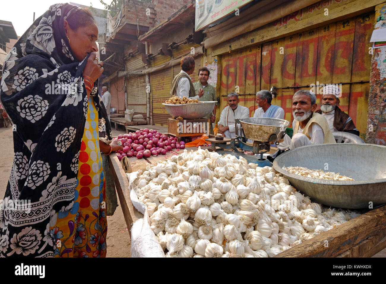 Garlic and onions for sale on a cart at an Indian street market Stock Photo