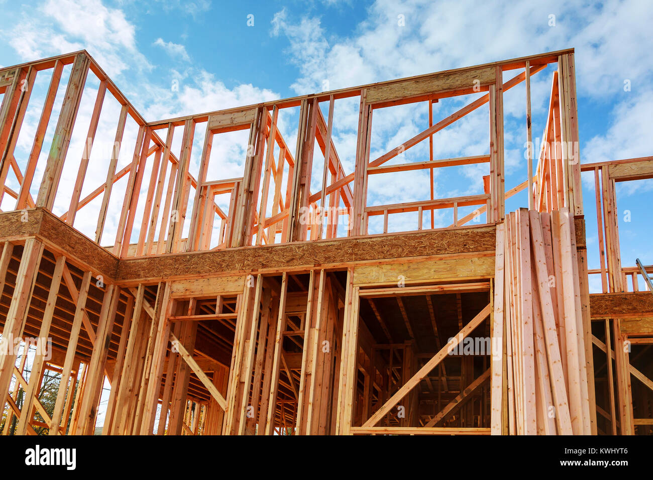 Framed New Construction of a House Building a new house Wooden framing of a home, full frame Stock Photo
