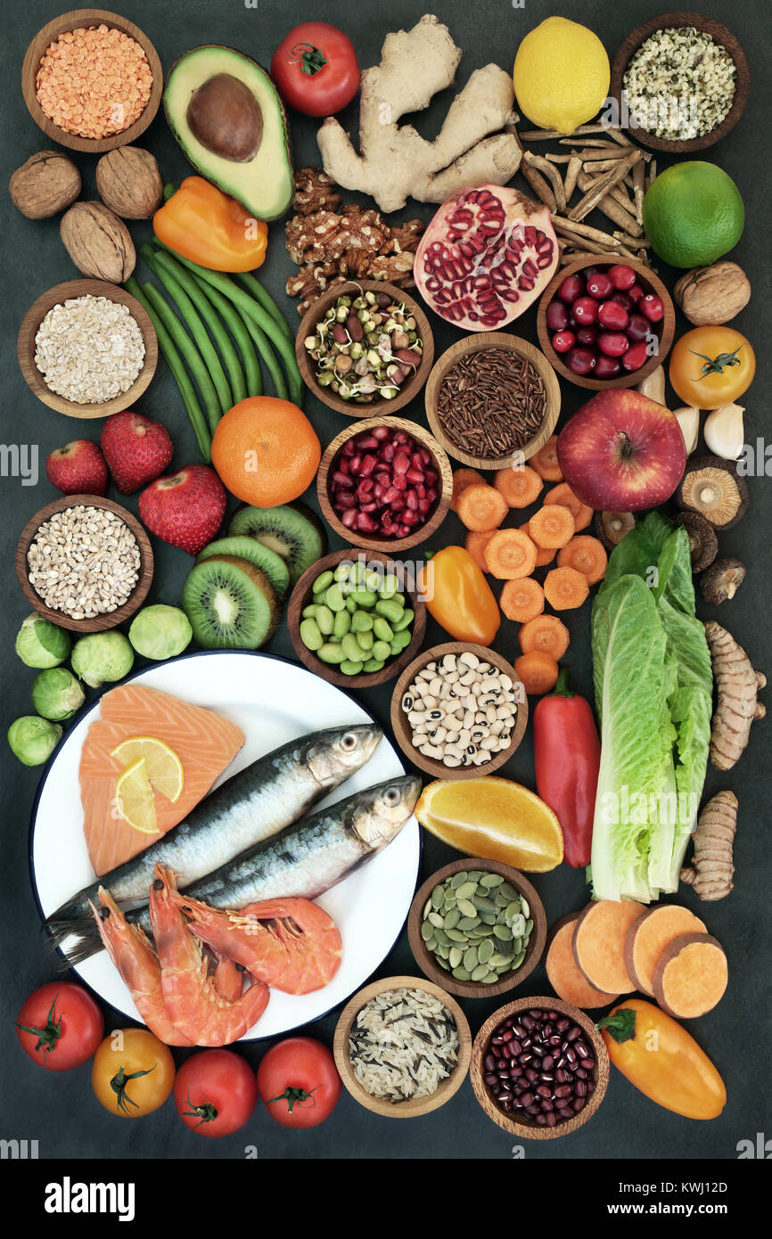 Health food with fresh fish, fruit,vegetables, seeds, nuts, pulses