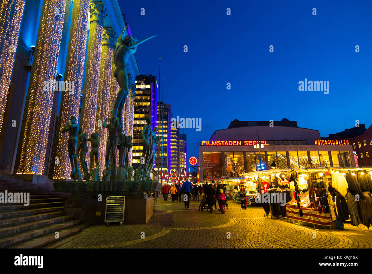 Konserthuset with Orpheus statue in front and Hotorget market lit up for Christmas at night, Stockholm, Sweden Stock Photo
