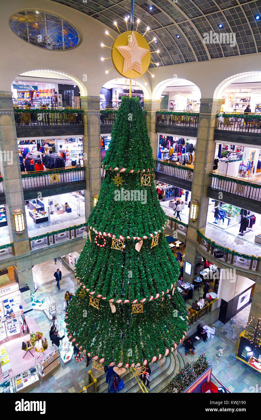 Large Christmas tree hung from the ceiling of NK department store in Stockholm, Sweden Stock Photo