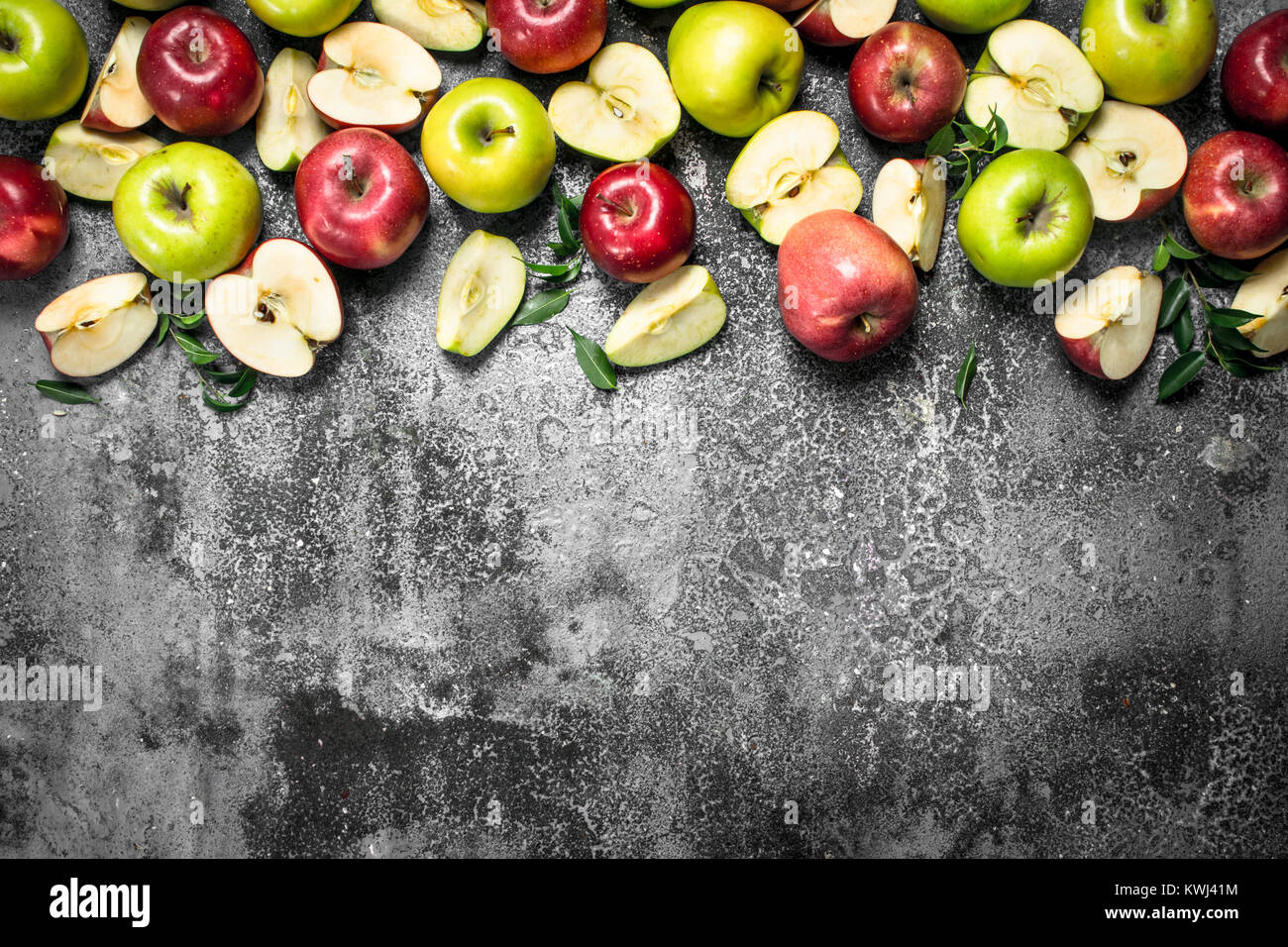 Red and green apples. On a rustic background Stock Photo - Alamy