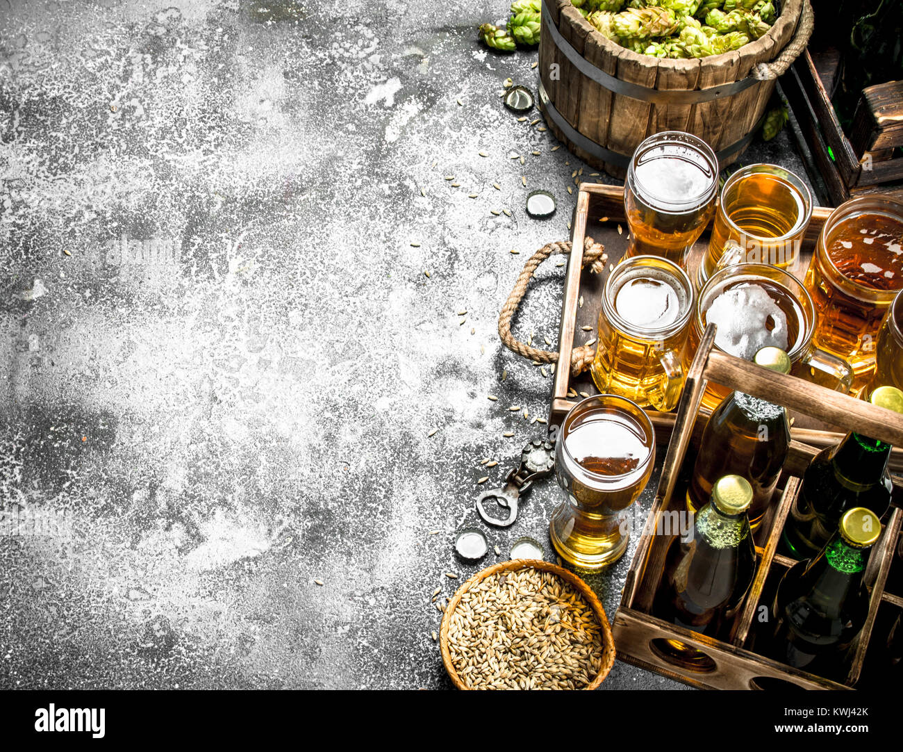 Beer background. Fresh beer with ingredients. On a rustic background