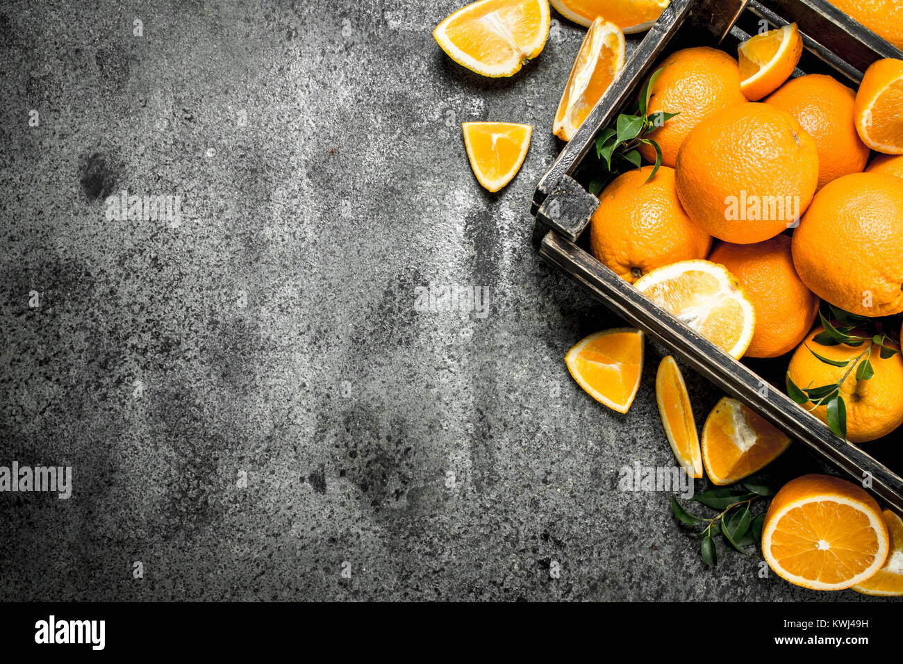 Fresh oranges in a box. On a rustic background Stock Photo - Alamy