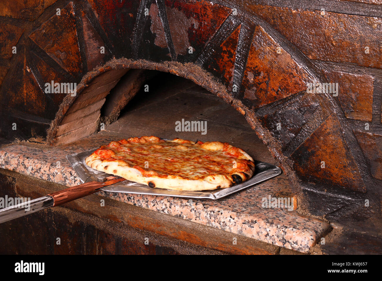 delicious pizza and brick oven Stock Photo