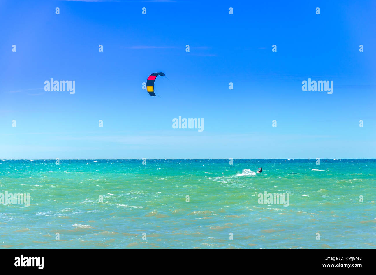 Single sport man surfing on their kite board by the sea Stock Photo - Alamy