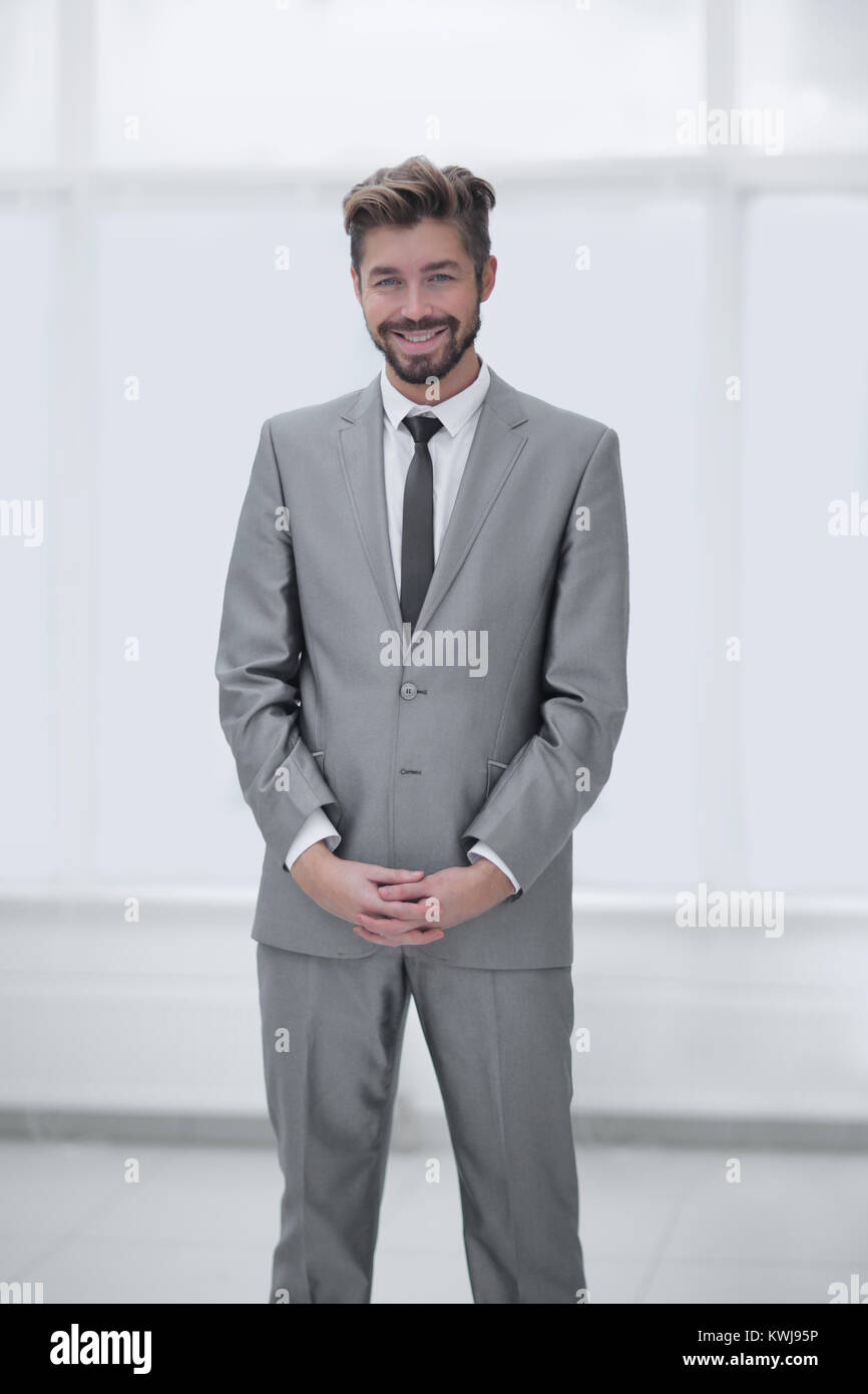 A young man in a gray suit Stock Photo - Alamy