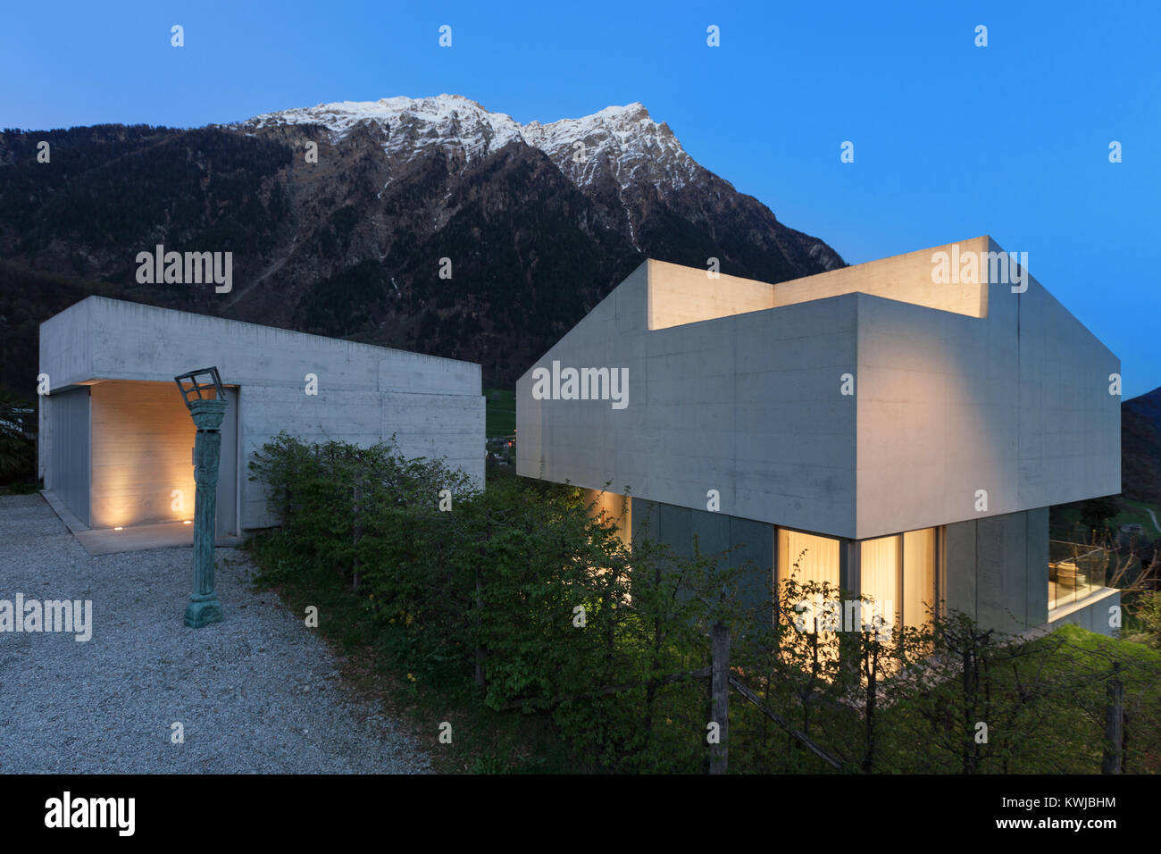 Architecture, entrance of a modern house, evening in mountain Stock Photo