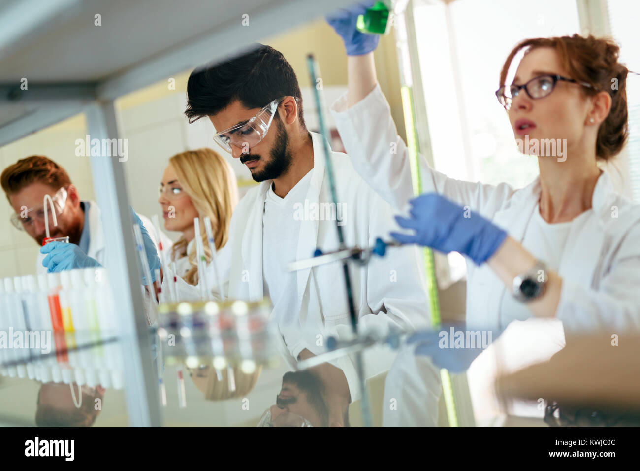 Group of scientists working at laboratory Stock Photo Alamy