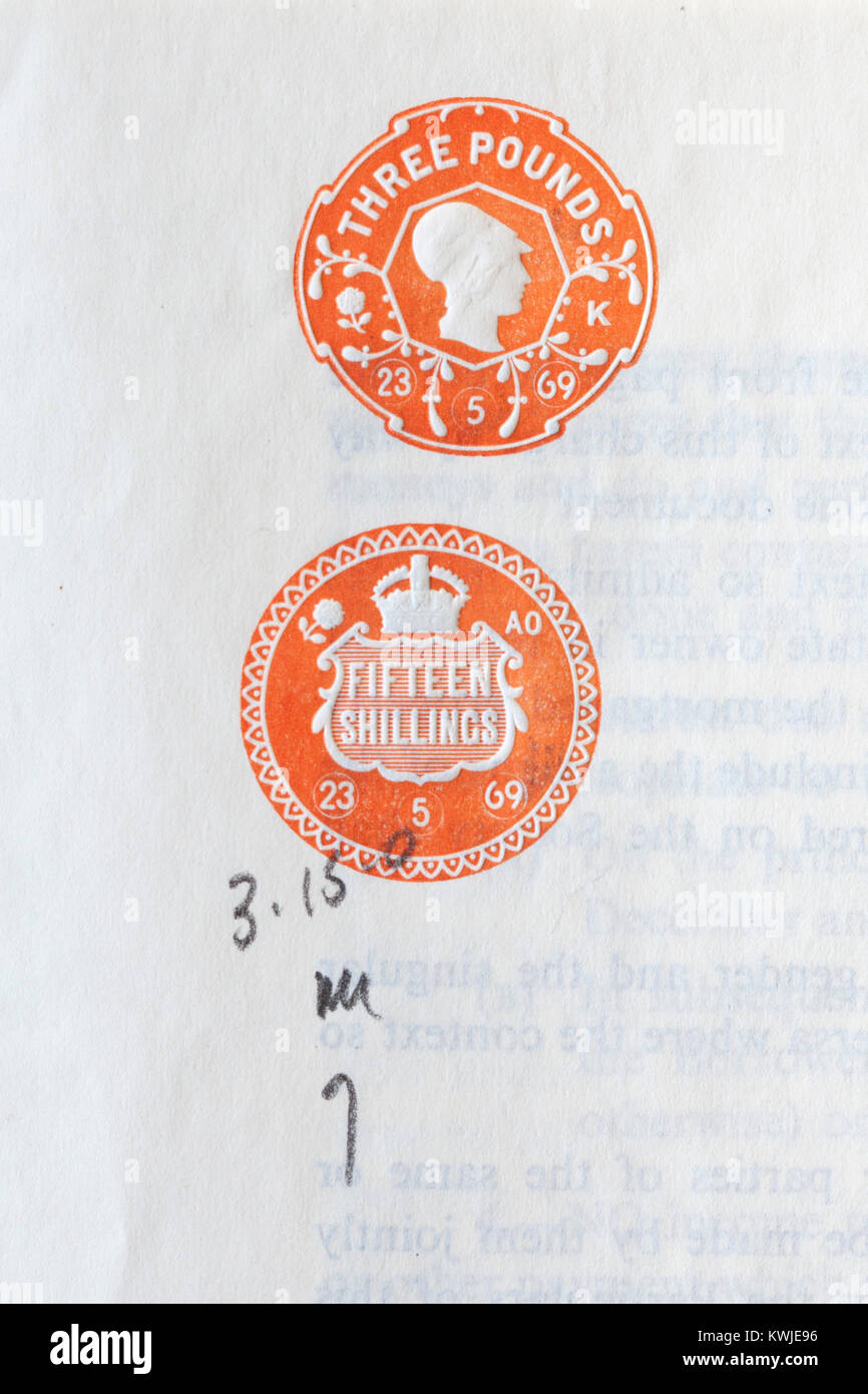 Old Inland Revenue embossed stamps on paper Stock Photo
